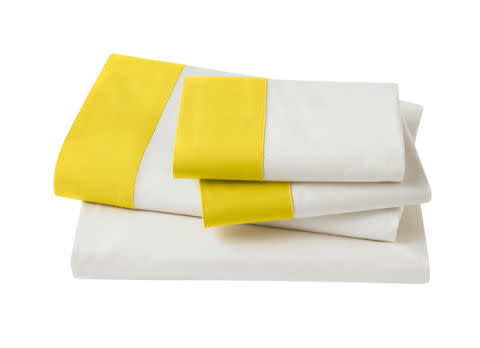 <p>Modern Border Citrine Sheet Set, $79, <a rel="nofollow noopener" href="https://www.dwellstudio.com/Modern-Border-Citrine-Sheet-Set-DWL4683.html" target="_blank" data-ylk="slk:dwellstudio.com;elm:context_link;itc:0;sec:content-canvas" class="link "><u>dwellstudio.com</u></a>.</p>