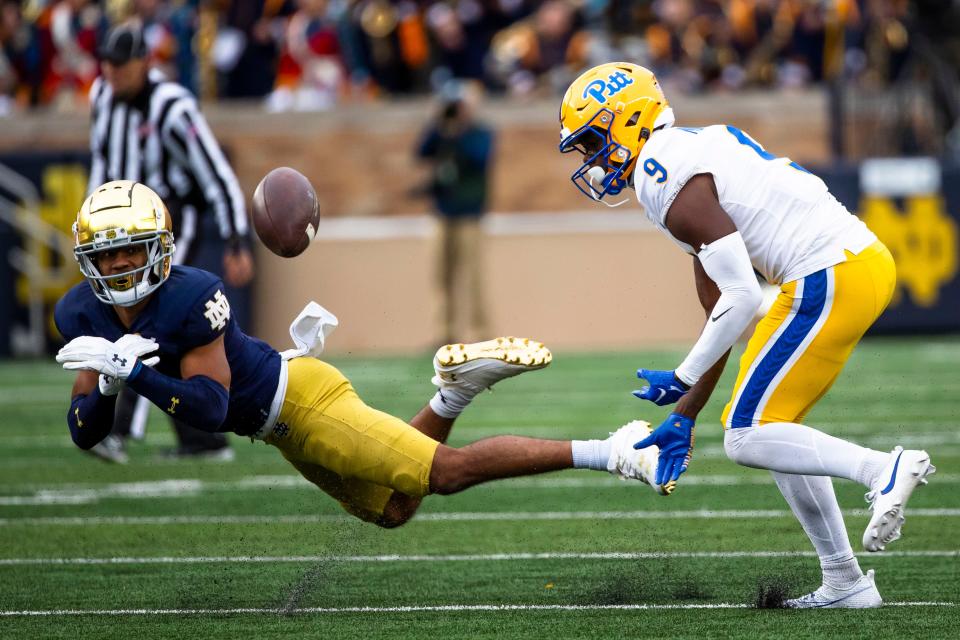 Notre Dame cornerback Jaden Mickey (7) breaks up a breaks up a pass intended for Pittsburgh wide receiver Konata Mumpfield (9) during the second half of an NCAA college football game Saturday, Oct. 28, 2023, in South Bend, Ind. (AP Photo/Michael Caterina)