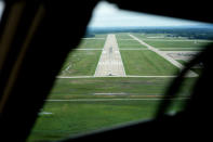 A jet sits on a runway creating a hazard seen from a Boeing 757 test aircraft on landing approach to demonstrate runway hazard warning systems over the airport in Tyler, Texas, Tuesday, June 4, 2024. (AP Photo/LM Otero)