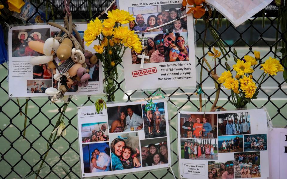 A memorial for the Guara family posted on a fence near the Champlain Towers South - Carl Juste /Miami Herald 