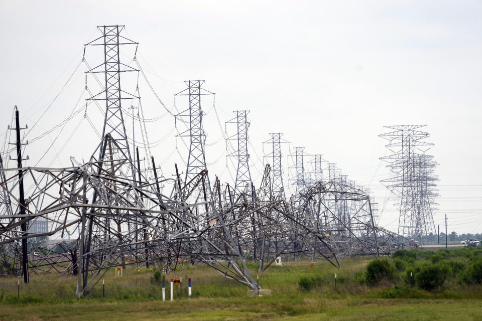 Down power lines are shown in the aftermath of a severe thunderstorm Friday, May 17, 2024, in Cypress, Texas, near Houston. Thunderstorms pummeled southeastern Texas on Thursday killing at least four people, blowing out windows in high-rise buildings and knocking out power to more than 900,000 homes and businesses in the Houston area. (AP Photo/David J. Phillip)