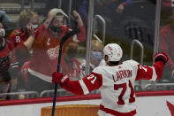 Detroit Red Wings center Dylan Larkin celebrates his game-winning goal in overtime of an NHL hockey game against the Washington Capitals, Wednesday, Oct. 27, 2021, in Washington. The Red Wings won 3-2. (AP Photo/Alex Brandon)