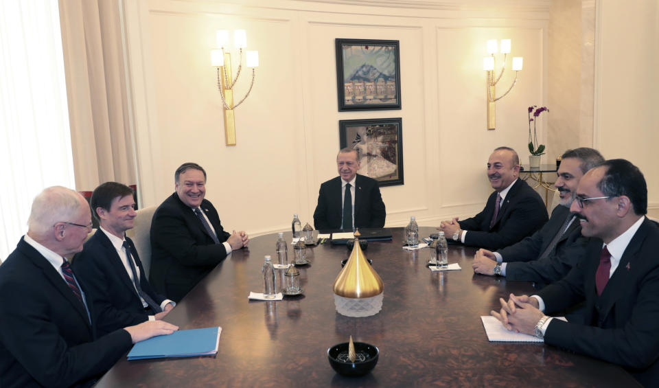 FILE - In this file photo dated Wednesday, Oct. 17, 2018, Turkey's President Recep Tayyip Erdogan, center, U.S. Secretary of State Mike Pompeo, third left, U.S. Special Representative for Syria Engagement James Franklin Jeffrey, left, Turkey's Foreign Minister Mevlut Cavusoglu, third right, Turkey's Intelligence Chief Hakan Fidan, second right, and Erdogan's Spokesman Ibrahim Kalin, right, speak during a meeting at the Esenboga Airport in Ankara, Turkey. Talks between Turkey and U.S. Special Envoy to Syria, Jeffrey have been inconclusive so far. (Presidential Press Service FILE via AP, Pool)