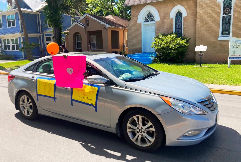 People drive along Bridge Street celebrating the birthdays of Cora Tyson and her pastor, the Rev. Alesia Ford-Burse, of St. Paul AME Church, on June 1, 2022, in front of Tyson's Lincolnville home. Tyson provided shelter to Martin Luther King Jr. during the civil rights movement.