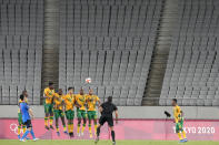 FILE - In this July 22, 2021, file photo, Japan's Maya Yoshida, left, takes a penalty kick against South Africa as the stands sit empty during a men's soccer match at the 2020 Summer Olympics in Tokyo, Japan. In arenas across Tokyo, athletes accustomed to feeding off the deafening roar of the crowd are searching for new ways to feel Olympic enthusiasm. (AP Photo/Shuji Kajiyama, File)