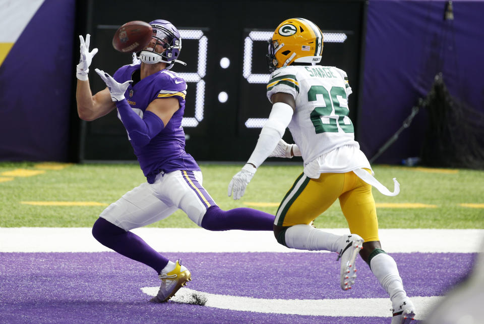 Minnesota Vikings wide receiver Adam Thielen catches a 37-yard touchdown pass ahead of Green Bay Packers safety Darnell Savage, right, during the second half of an NFL football game, Sunday, Sept. 13, 2020, in Minneapolis. (AP Photo/Bruce Kluckhohn)