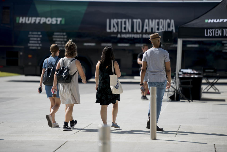 HuffPost staffers (from left to right: Christine Roberts, Melissa Radzimski, Emma Gray and Ja'han Jones) make their way to the bus activation site.
