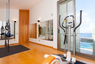 <p>Sweat out that holiday hangover in the gym. (Airbnb) </p>