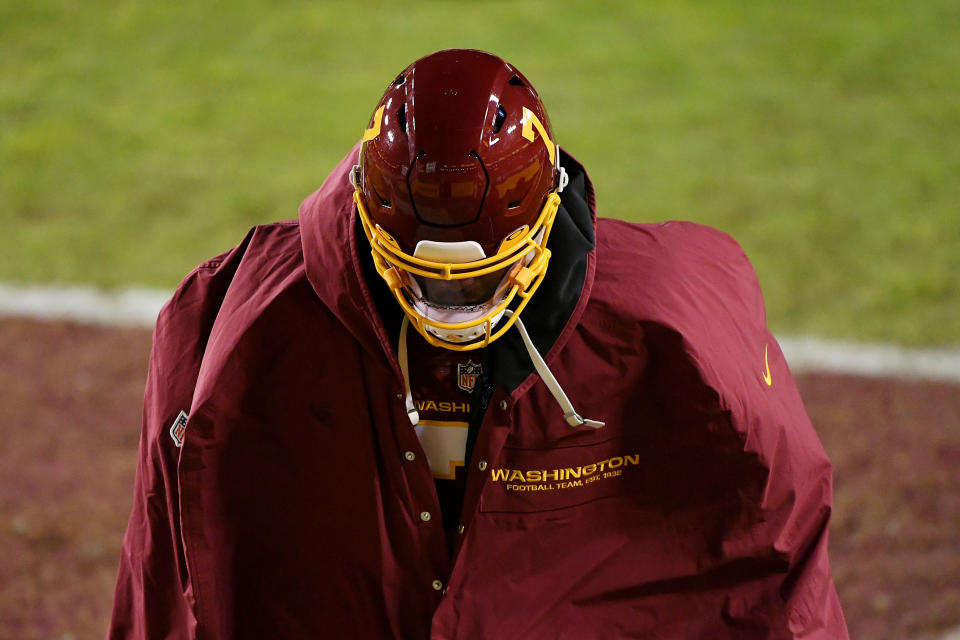 Dwayne Haskins #7 of the Washington Football Team walks off the field after losing to the Carolina Panthers 20-13 at FedExField on December 27, 2020 in Landover, Maryland. (Photo by Will Newton/Getty Images)