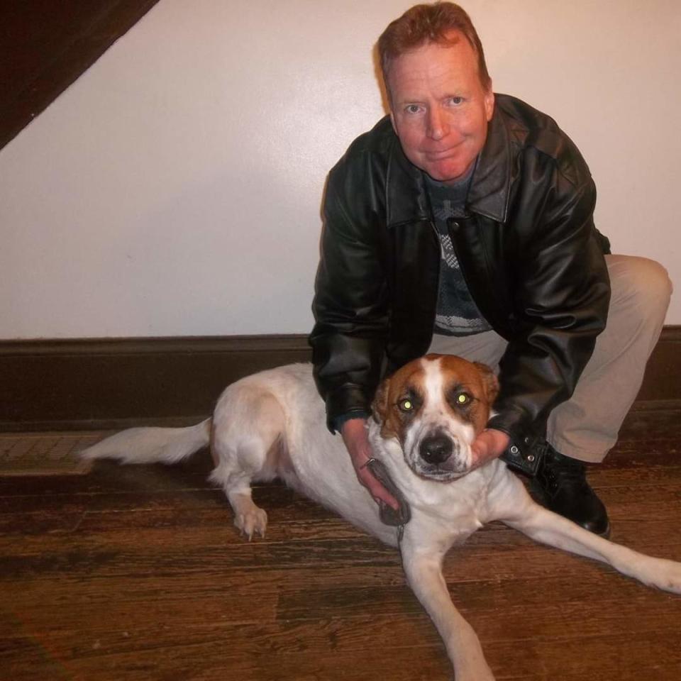 Family photo of Steven Q. Troyer, and Bernard, a dog who died a few years ago.