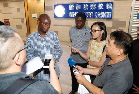Adam Molai, son-in-law of Albert Mugabe, the late brother of Zimbabwe's former President Robert Mugabe speaks to the media in Singapore