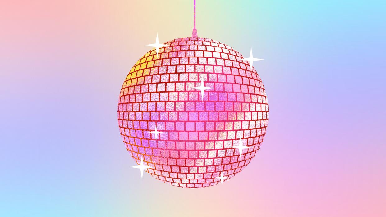  A pink disco ball on a colorful background 