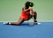 Serena Williams of the U.S. gets up slowly from the court in the third set against Roberta Vinci of Italy during their women's singles semi-final match at the U.S. Open Championships tennis tournament in New York, September 11, 2015. REUTERS/Lucas Jackson