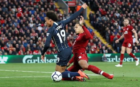 Manchester City are awarded a penalty by referee Martin Atkinson after Manchester City's Leroy Sane is brought down by Liverpool's Virgil van Dijk - Credit: REuters