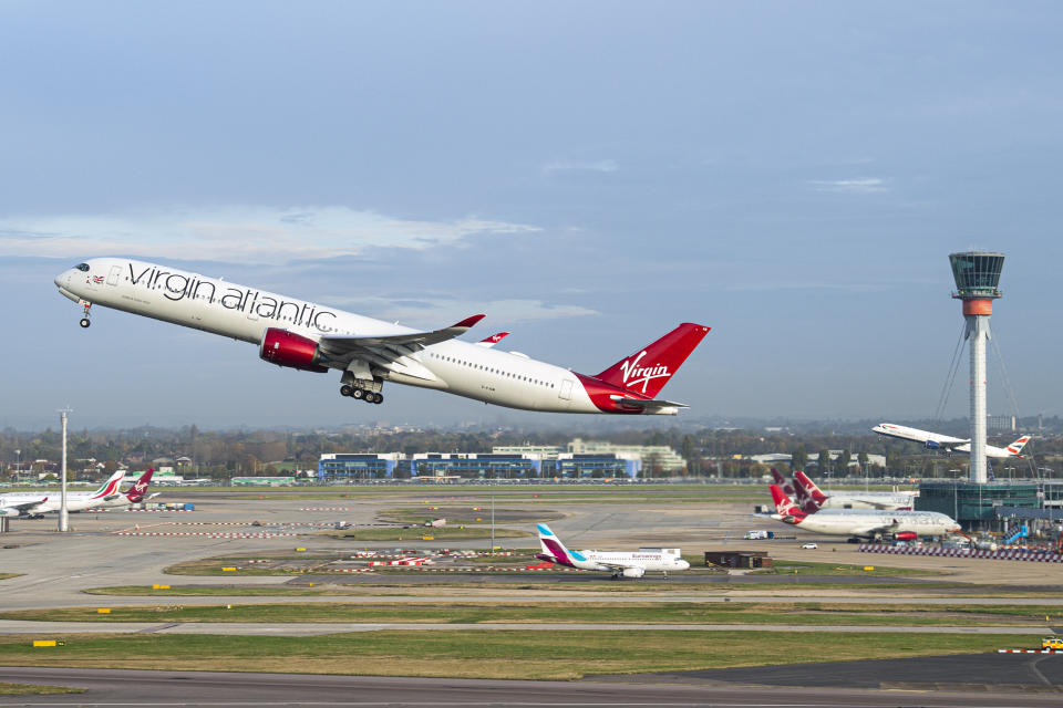 EDITORIAL USE ONLY Virgin Atlantic flight VS3 (front) and British Airways flight BA001 (back) perform a synchronised departure on parallel runways at London Heathrow Airport, heading for New York JFK to celebrate the reopening of the transatlantic travel corridor, more than 600 days since the US travel ban was introduced due to the Covid-19 pandemic. Picture date: Monday November 8, 2021.