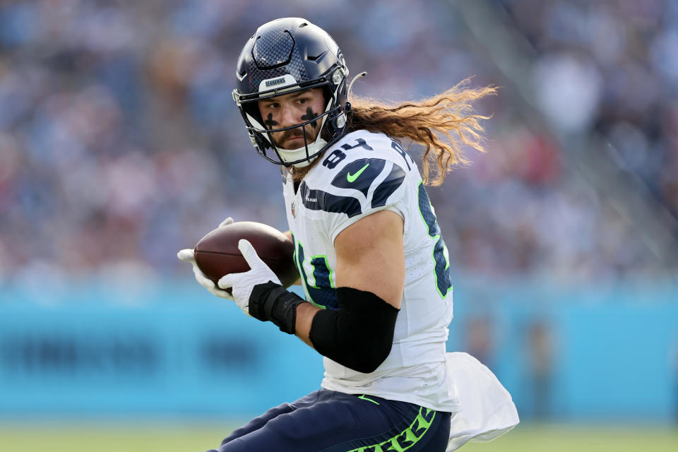 NASHVILLE, TENNESSEE - DECEMBER 24: Colby Parkinson #84 of the Seattle Seahawks runs the ball during the first half in the game against the Tennessee Titans at Nissan Stadium on December 24, 2023 in Nashville, Tennessee. (Photo by Andy Lyons/Getty Images)