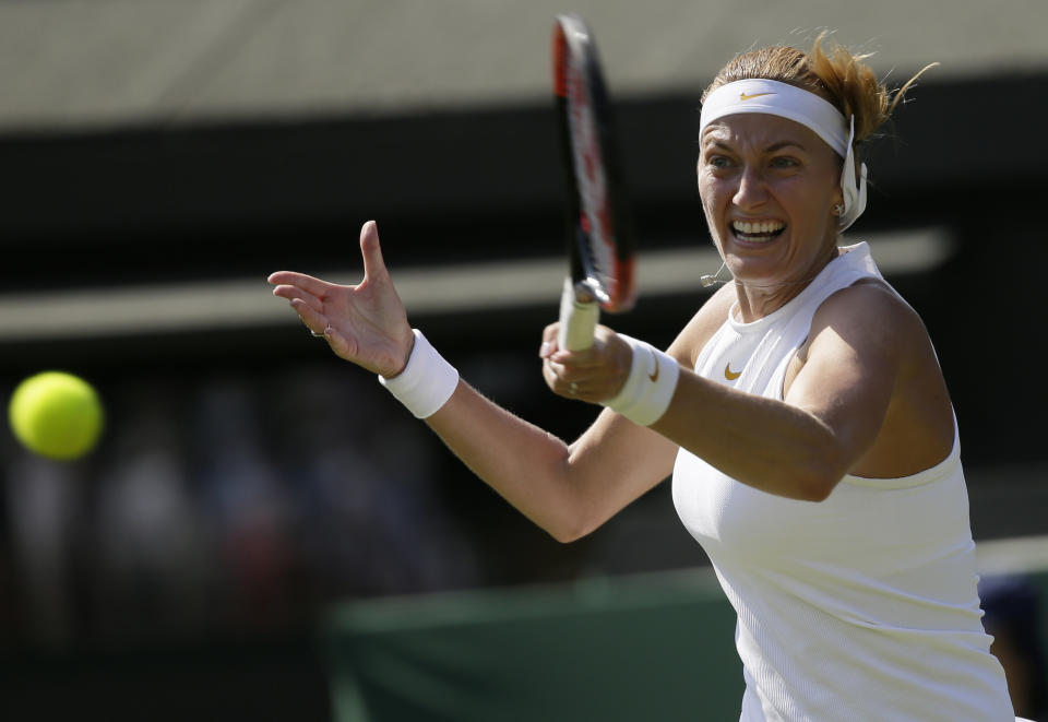 FILE - In this July 3, 2018, file photo, Petra Kvitova of the Czech Republic returns a ball to Aliaksandra Sasnovich of Belarus during their women's singles match on the second day at the Wimbledon Tennis Championships in London. Two-time Wimbledon champion Petra Kvitova said on Tuesday June 25, 2019, that she has resumed training and will decide later this week whether she's fit enough to play at the All England Club this year. (AP Photo/Tim Ireland)