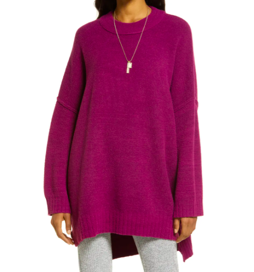 Model wears Free People Peaches knit Tunic in purple