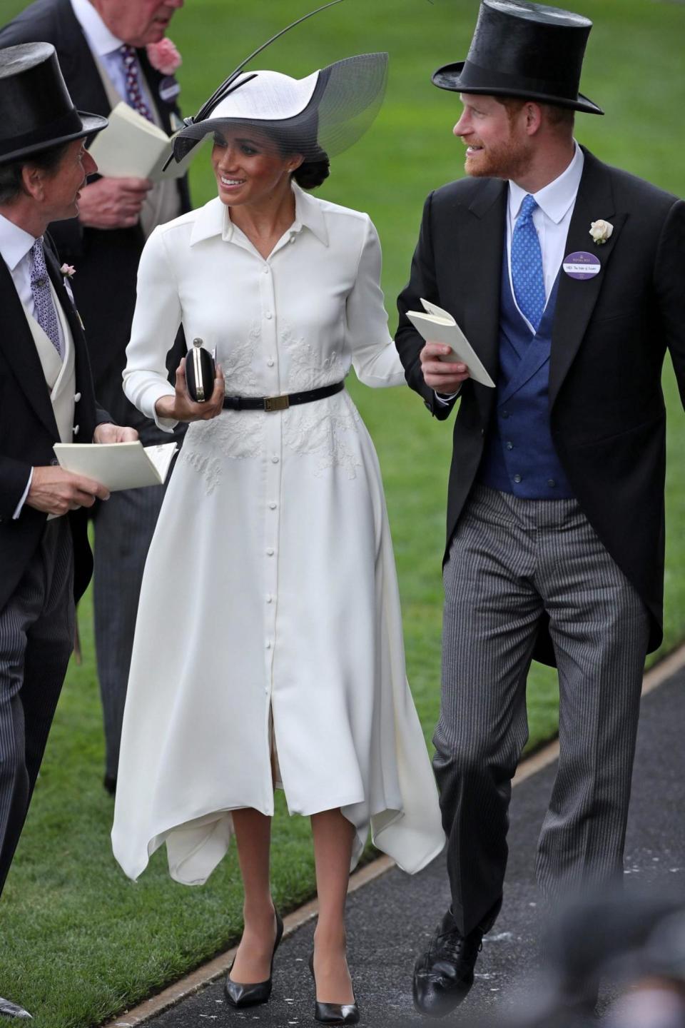 The Duchess wore a mid-length white dress with a black belt and shoes (AFP/Getty Images)