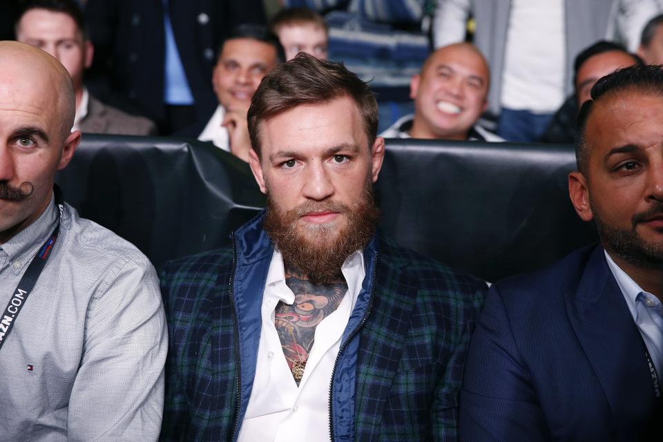 UFC champion Conor McGregor sits ringside before the boxing match between Demetrius Andrade and Walter Kautondokwa in Boston, Saturday, Oct. 20, 2018. (AP Photo/Michael Dwyer)