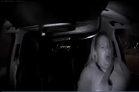 A still frame taken from video released March 21, 2018 shows the interior view of an unidentified operator in a self-driving Uber vehicle reacting as she looks through the windshield leading up to a fatal collision in Tempe, Arizona, U.S. on March 18, 2018. Tempe Police Department/Handout via REUTERS