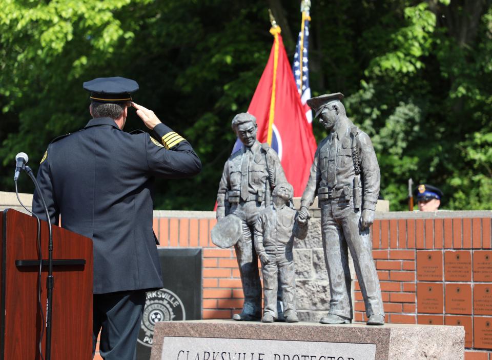 Clarksville Police Deputy Chief Rick Stalder salutes the flag during the Presentation of Colors at Friday's Law Enforcement Officer's Memorial.