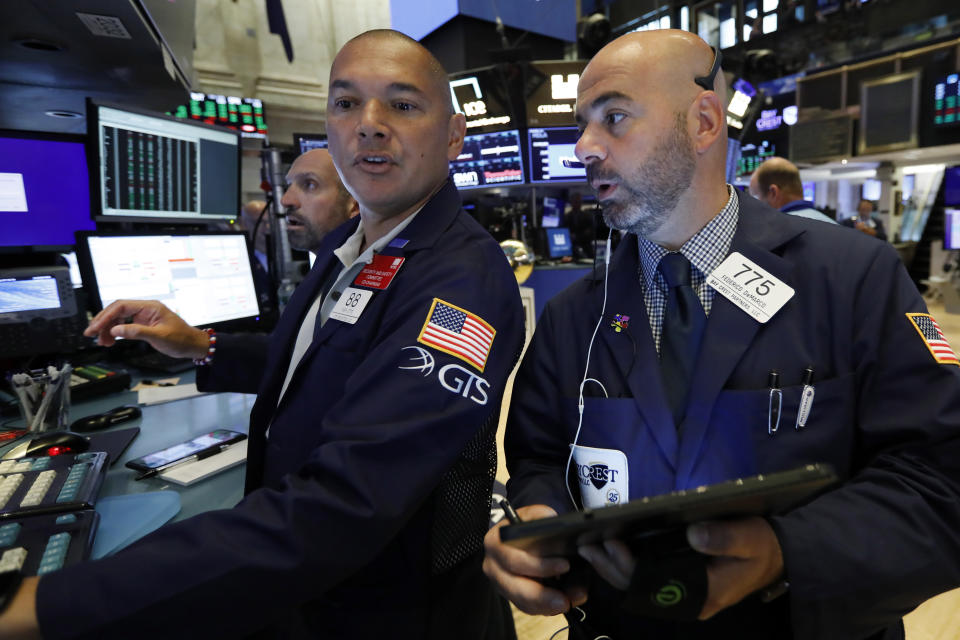 Specialist Mark Otto, left, and trader Fred DeMarco work on the floor of the New York Stock Exchange, Friday, July 19, 2019. U.S. stocks moved broadly higher in early trading on Wall Street Friday and chipped away at the week's losses. (AP Photo/Richard Drew)