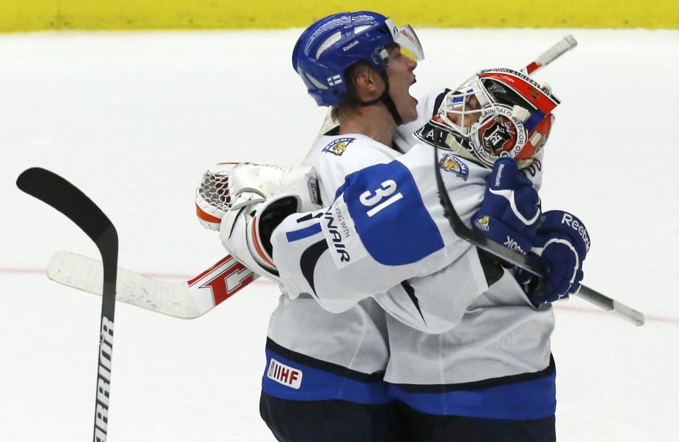 Finland's Rasmus Ristolainen (L) is gone, but goalie Juuse Saros returns for the defending champs. REUTERS/Alexander Demianchuk 