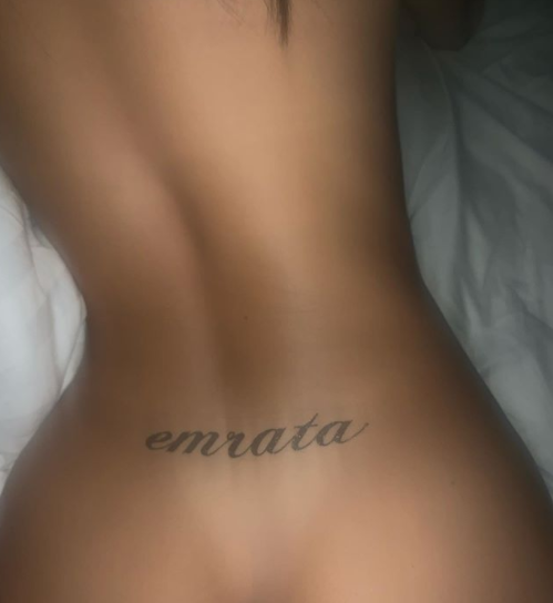 Image of Emily Ratajkowski with 'Emrata' tattooed across her lower back