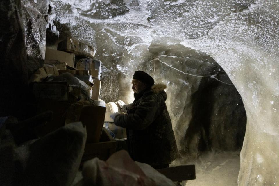 Sergey checks materials stored underground in the permafrost (Reuters)