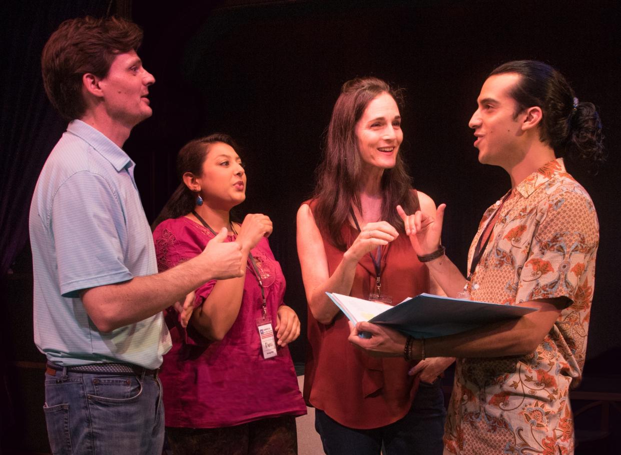 Playwright Jason Odell Williams, left, talks with cast members Lipica Sha, Charlotte Cohn and Nicholas Caycedo during rehearsals for the world premiere of his play “America in One Room” at Florida Studio Theatre.