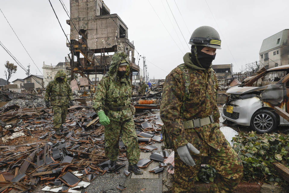 Members of the Japan Self-Defense Forces conduct a search operation in Wajima, Ishikawa prefecture, Japan Wednesday, Jan. 10, 2024. A powerful earthquake slammed the western coastline of Japan on New Year’s Day. (Kyodo News via AP)