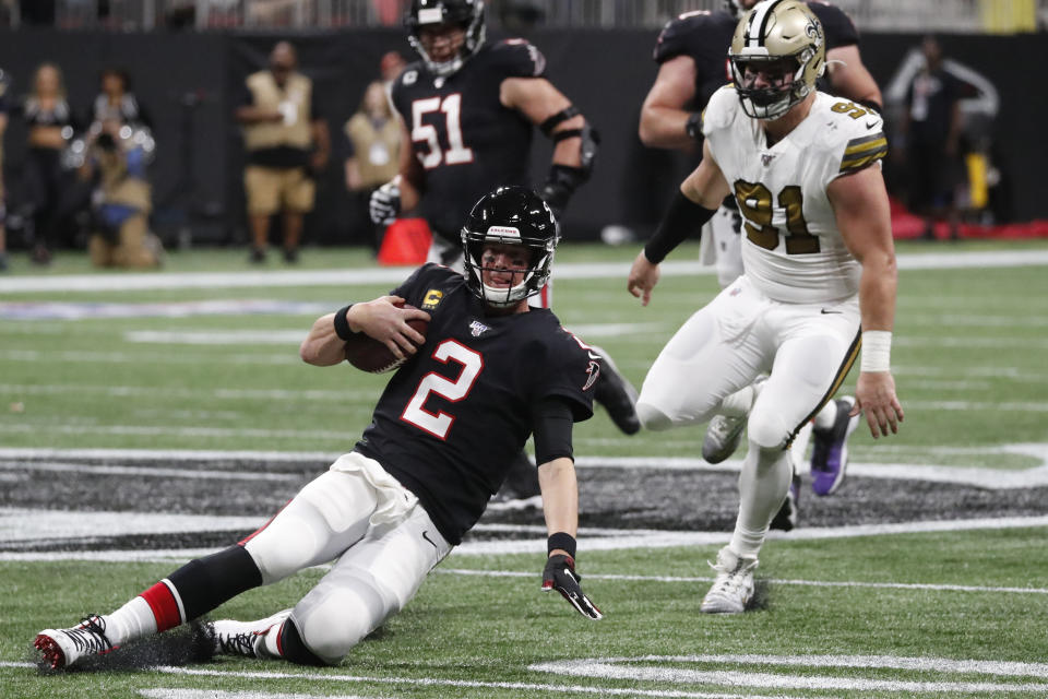 Atlanta Falcons quarterback Matt Ryan (2) slides to the turf after during the first half of an NFL football game against the New Orleans Saints, Thursday, Nov. 28, 2019, in Atlanta. (AP Photo/John Bazemore)