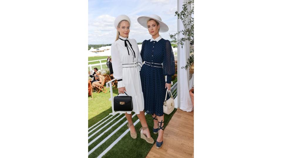 Lady Eliza Spencer and Lady Amelia Spencer pose in floaty dresses and hats