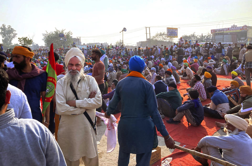 Indian farmers protesting new agriculture laws hold a meeting at the Delhi-Haryana state border, Monday, Nov. 30, 2020. Indian Prime Minister Narendra Modi tried to placate thousands of farmers protesting new agriculture laws Monday and said they were being misled by opposition parties and that his government would resolve all their concerns. (AP Photo/Rishi Lekhi)