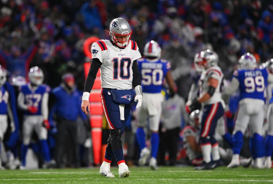 Jan 15, 2022; Orchard Park, New York, USA; New England Patriots quarterback Mac Jones (10) reacts to an interception during the third quarter of the AFC Wild Card playoff game against the Buffalo Bills at Highmark Stadium. Mandatory Credit: Rich Barnes-USA TODAY Sports