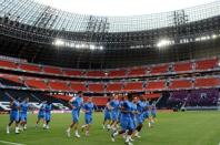 France's national football team players warm up during a training session at the training center in Kircha. England and France launch their respective quests for major tournament redemption here Monday in a high-stakes Group D collision that neither side can afford to lose