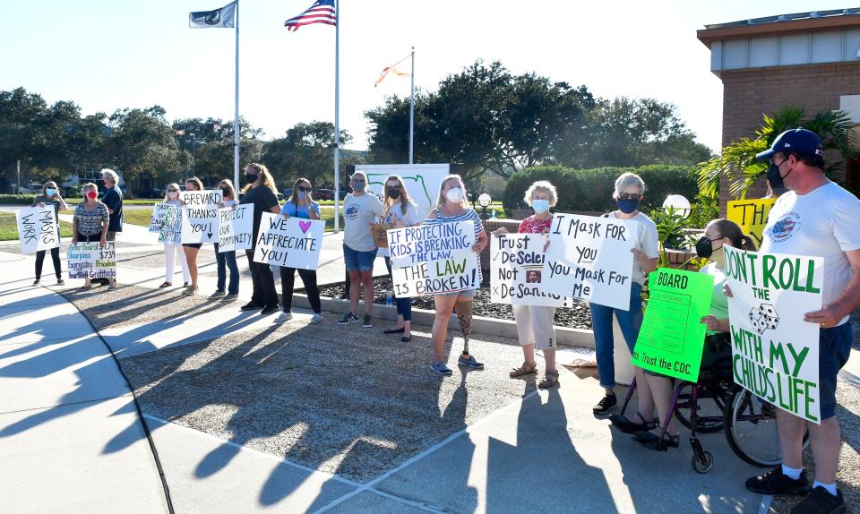 Pro-mask supporters are pictured before the Oct. 26, 2021, Brevard County School Board meeting in Viera. Before the meeting, groups representing both sides of the mask mandate issue gathered outside to express their views.