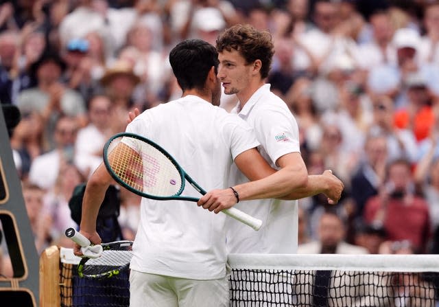 Carlos Alcaraz and Ugo Humbert (right) hug 