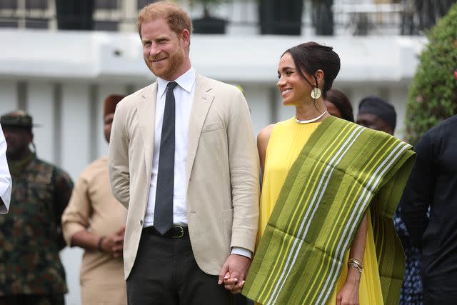 <p>KOLA SULAIMON/AFP via Getty</p> Prince Harry and Meghan Markle at the reception at State Governor House in Lagos, Nigeria on May 12, 2024.
