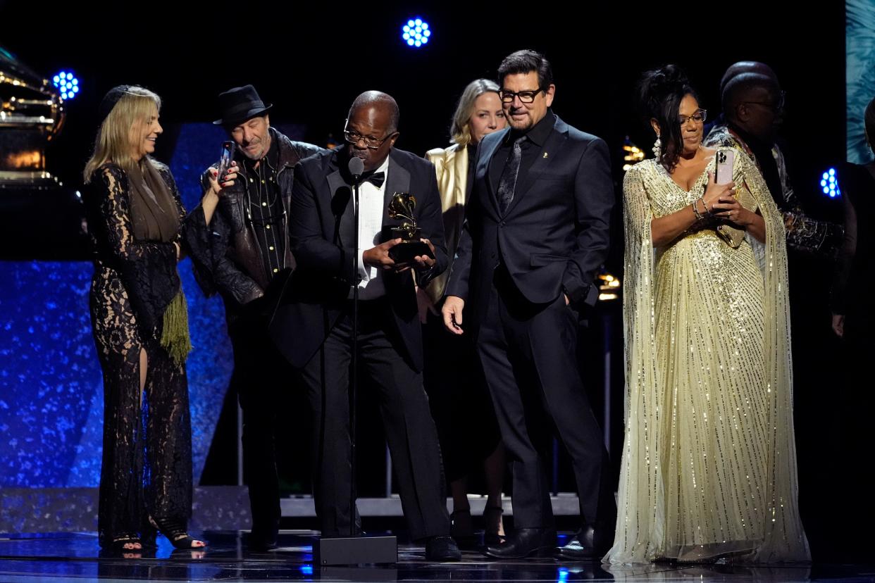 Scotty Barnhart, center, of The Count Basie Orchestra accepts the award for best large jazz ensemble album for "Basie Swings The Blues" during the 66th annual Grammy Awards on Sunday, Feb. 4, 2024, in Los Angeles. (AP Photo/Chris Pizzello)