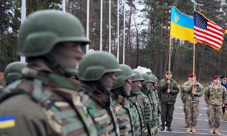 US and Ukrainian soldiers attend an opening ceremony of the joint Ukrainian-US military exercise 'Fearless Guardian' at the Yavoriv training ground on April 20, 2015 in the region of Lviv
