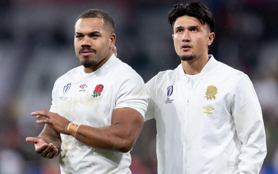 Ollie Lawrence of England and Marcus Smith of England applaud the fans after their sides defeat during the Rugby World Cup France 2023 match between England and South Africa at Stade de France on October 21, 2023 in Paris, France