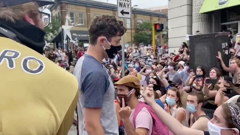 Social media video grab of Minneapolis Mayor Jacob Frey walking through a crowd of jeering protesters, in the aftermath of the death in Minneapolis police custody of George Floyd