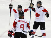 Ice Hockey - Pyeongchang 2018 Winter Olympics - Women's Semifinal Match - Canada v Olympic Athletes from Russia - Gangneung Hockey Centre, Gangneung, South Korea - February 19, 2018 - Jenn Wakefield of Canada celebrates her third period goal with teammates Laura Fortino and Natalie Spooner (R). REUTERS/Grigory Dukor