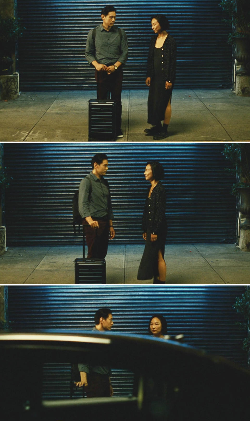 Hae Sung and Nora standing together, stealing glances, on the sidewalk