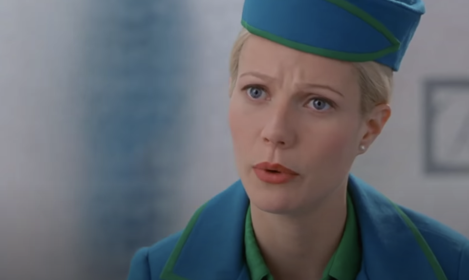 Donna sitting in her flight attendant uniform