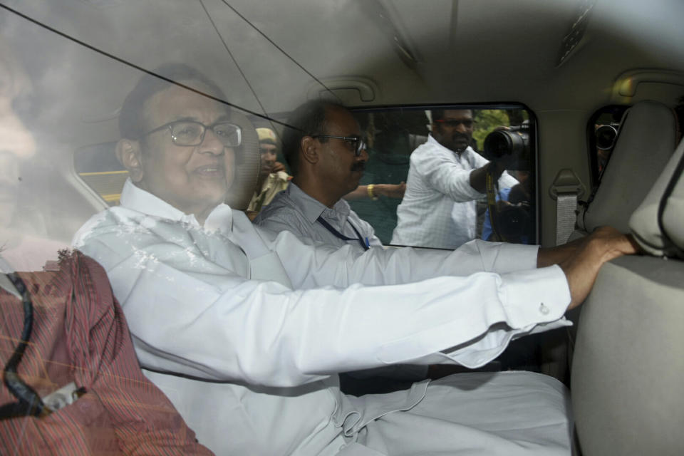 India's opposition Indian National Congress party leader Palaniappan Chidambaram leaves the Central Bureau of Investigation headquarters to be produced before a court in New Delhi, India, Thursday, Aug. 22, 2019. Chidambaram was taken into custody on suspicion of conspiring with a Mauritius-based firm to illegally obtain money for his son's company while he was India's finance minister in 2006. (AP Photo/Dinesh Joshi)