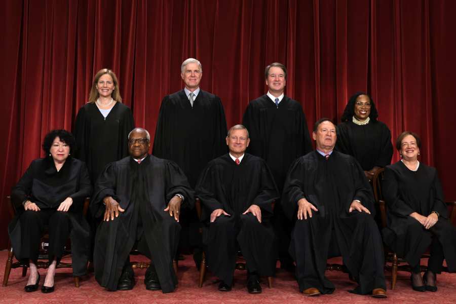 United States Supreme Court (front row L-R) Associate Justice Sonia Sotomayor, Associate Justice Clarence Thomas, Chief Justice of the United States John Roberts, Associate Justice Samuel Alito, and Associate Justice Elena Kagan, (back row L-R) Associate Justice Amy Coney Barrett, Associate Justice Neil Gorsuch, Associate Justice Brett Kavanaugh and Associate Justice Ketanji Brown Jackson pose for their official portrait at the East Conference Room of the Supreme Court building on October 7, 2022 in Washington, D.C. (Photo by Alex Wong/Getty Images)