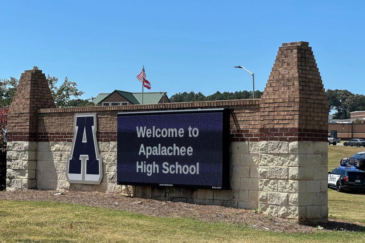 PHOTO: Law enforcement arrives as students are evacuated to the football stadium after the school campus was placed under lockdown at Apalachee High School in Winder, Georgia, on September 4, 2024. (Jeff Amy/AP)